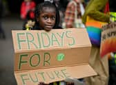 School children take part in a climate strike popularised by Swedish activist Greta Thunberg on September 24, 2021 in Glasgow, Scotland (Photo by Jeff J Mitchell/Getty Images)