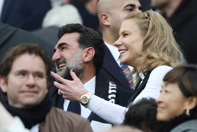 Non-executive chairman of Newcastle United, Yasir Al-Rumayyan and Amanda Staveley, part-owner, smile as they are introduced to the fans prior to the Premier League match between United and Tottenham Hotspur at St. James Park on October 17, 2021.
