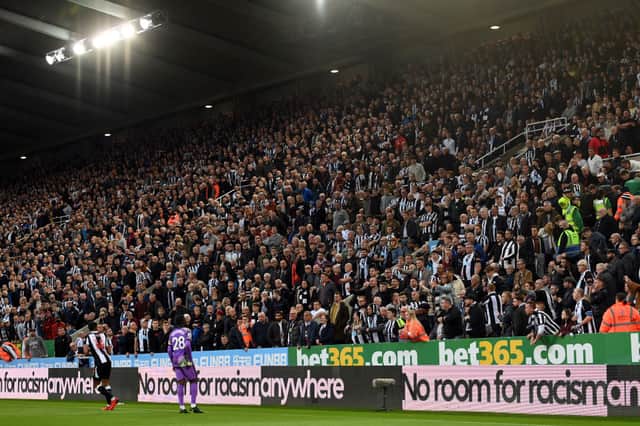 A general view inside the stadium as the fans of Newcastle United explain to Isaac Hayden of Newcastle United and Tanguy Ndombele of Tottenham Hotspur.