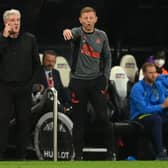 Former Newcastle manager Steve Bruce (l) with coach Graeme Jones on the touchline during the Premier League match between Newcastle United and Tottenham Hotspur at St. James Park on October 17, 2021 in Newcastle upon Tyne, England.