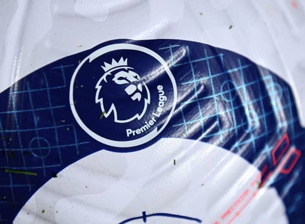 <p>A logo is pictured on a new Nike Flight ball during the English Premier League football match between Brighton and Hove Albion and Crystal Palace at the American Express Community Stadium in Brighton, southern England on February 22, 2021.</p>