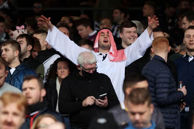 Newcastle United fans show their support prior to the Premier League match between Crystal Palace and Newcastle United at Selhurst Park on October 23, 2021 in London, England.