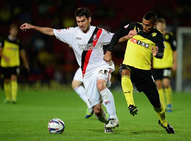 <p>Lewis McGugan of Watford battles with Richard Hughes of Bournemouth during the Capital One Cup second round match between Watford and AFC Bournemouth at Vicarage Road on August 28, 2013 in Watford, England.  (Photo by Jamie McDonald/Getty Images)</p>
