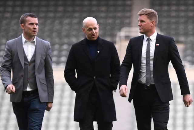 New Newcastle Head Coach Eddie Howe (r) chats with members of his management company on the pitch at his unveiling press conference at St. James Park on November 10, 2021 in Newcastle upon Tyne, England. (Photo by Stu Forster/Getty Images)