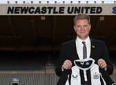 Newcastle United’s newly appointed manager, Eddie Howe poses with a team shirt on the pitch at their St James’ Park ground in Newcastle-upon-Tyne, north east England on November 10, 2021. 