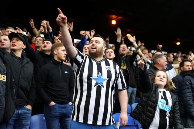 Newcastle United fans gesture during the Premier League match between Crystal Palace and Newcastle United at Selhurst Park on October 23, 2021 in London, England.