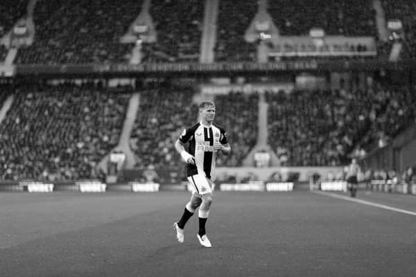 Matt Ritchie of Newcastle United prepares to take a corner kick during the Premier League match between Wolverhampton Wanderers and Newcastle United at Molineux on October 02, 2021 in Wolverhampton, England. 