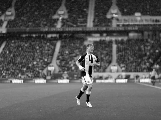 Matt Ritchie of Newcastle United prepares to take a corner kick during the Premier League match between Wolverhampton Wanderers and Newcastle United at Molineux on October 02, 2021 in Wolverhampton, England. 