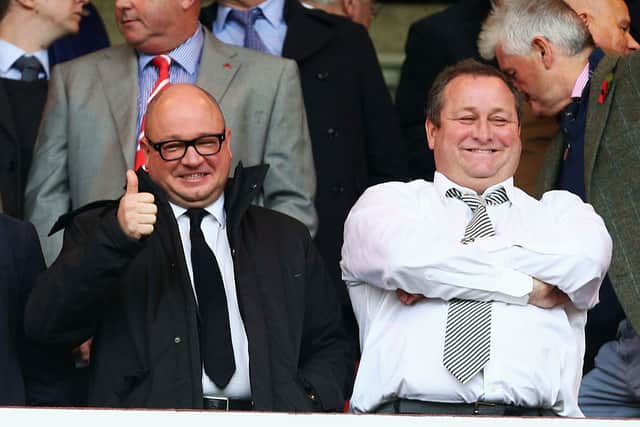Newcastle owner Mike Ashley (R) and Managing Director Lee Charnley (L) are seen on the stand prior to the Barclays Premier League match between Sunderland and Newcastle United at Stadium of Light on October 25, 2015 in Sunderland, England.  