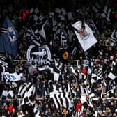 Newcastle United fans wave flags as they show their support prior to Premier League match versus Brentford at St. James Park. (Photo by George Wood/Getty Images)