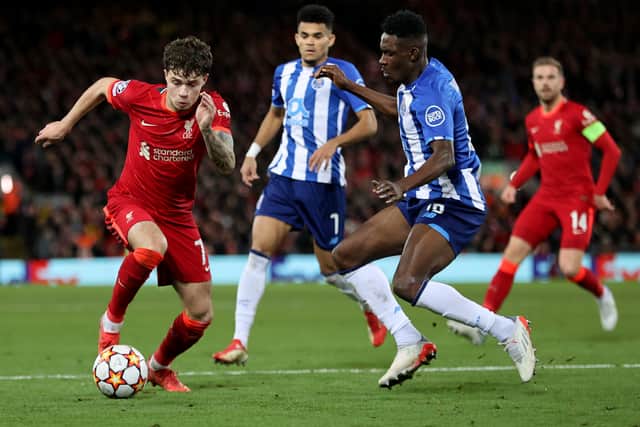 Zaidu Sanusi of FC Porto puts Neco Williams of Liverpool under pressure during the UEFA Champions League group B match between Liverpool FC and FC Porto at Anfield on November 24, 2021 in Liverpool, England. (Photo by Clive Brunskill/Getty Images)