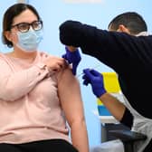 A woman received her Covid-19 vaccination booster (Image: Getty Images)