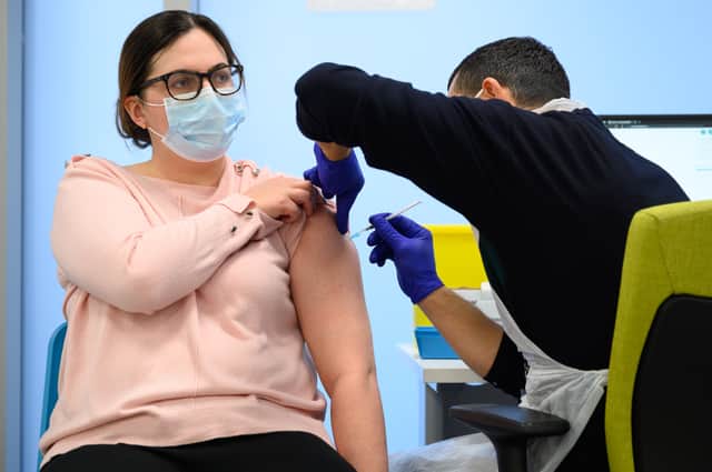 A woman received her Covid-19 vaccination booster (Image: Getty Images)