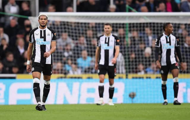 Joelinton of Newcastle United walks back to the halfway line with teammates after Brentford score their second goal during the Premier League match between Newcastle United and Brentford at St. James Park on November 20, 2021.