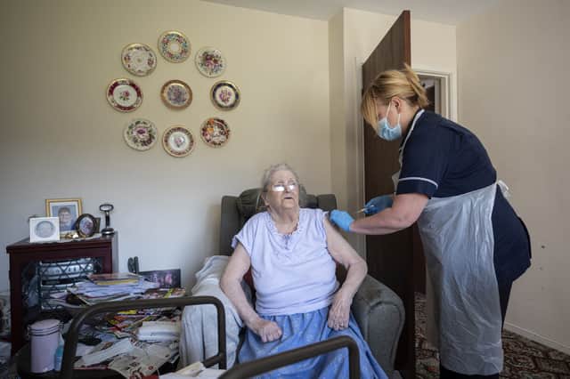 A vaccine is administered in a UK care home (Image: Getty Images)