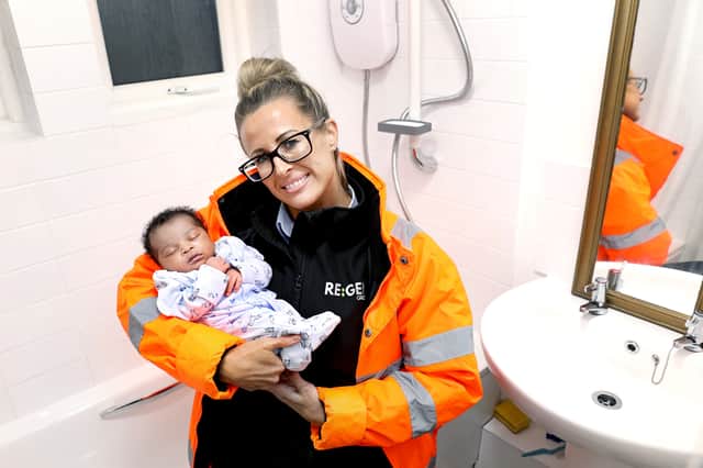 Liza Hi with baby Nelly in the newly fitted bathroom