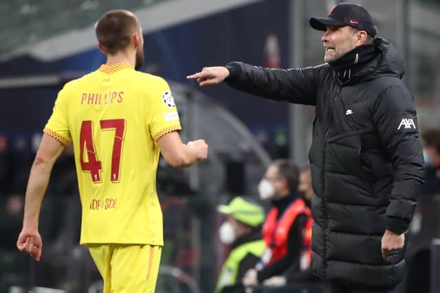 Jurgen Klopp shares a word with Nat Phillips. Photo: Marco Luzzani/Getty Images