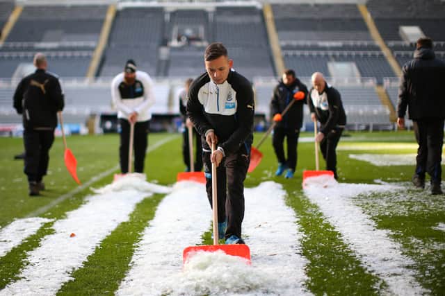 Newcastle United ground keepers clears snow from St. James’ Park back in 2015.