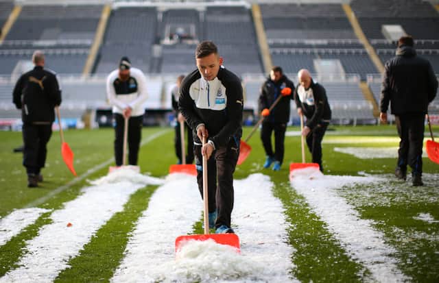 Newcastle United ground keepers clears snow from St. James’ Park back in 2015.