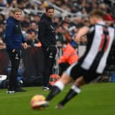 Newcastle manager Eddie Howe (l) and coach Jason Tindall watch from the sidelines during the Premier League match between Newcastle United  and  Manchester City at St. James Park on December 19, 2021 in Newcastle upon Tyne, England. 