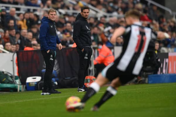 Newcastle manager Eddie Howe (l) and coach Jason Tindall watch from the sidelines during the Premier League match between Newcastle United  and  Manchester City at St. James Park on December 19, 2021 in Newcastle upon Tyne, England. 