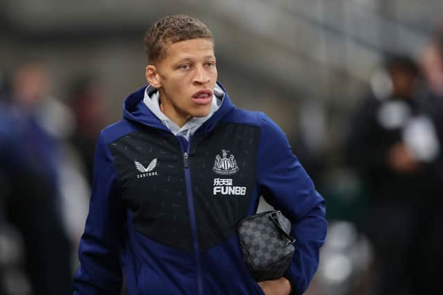 Dwight Gayle of Newcastle United looks on as he arrives at the stadium prior to the Premier League match between Newcastle United and Norwich City at St. James Park on November 30, 2021 in Newcastle upon Tyne, England.