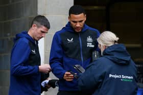 Ciaran Clark and Jamaal Lascelles of Newcastle United have their Covid-19 passes scanned as they arrive at the stadium prior to the Premier League match between Newcastle United and Manchester City at St. James Park on December 19, 2021 in Newcastle upon Tyne, England.