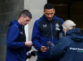 Ciaran Clark and Jamaal Lascelles of Newcastle United have their Covid-19 passes scanned as they arrive at the stadium prior to the Premier League match between Newcastle United and Manchester City at St. James Park on December 19, 2021 in Newcastle upon Tyne, England.