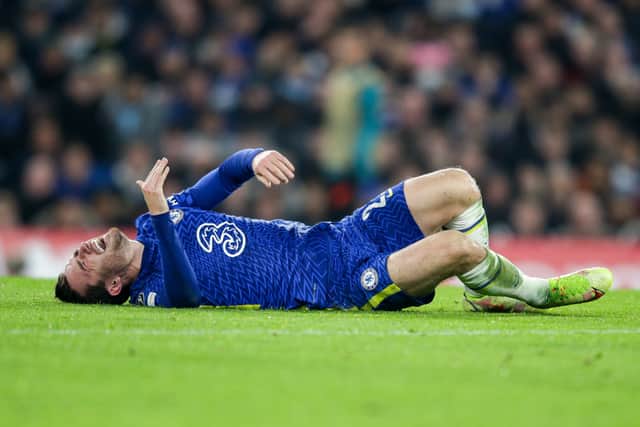 Ben Chilwell of Chelsea goes down injured before he is replaced during the UEFA Champions (Photo by Robin Jones/Getty Images)