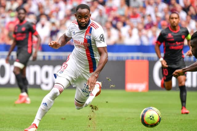 Lyon’s French forward Moussa Dembele runs with the ball during the French L1 football match between Olympique Lyonnais and Clermont Foot 63 at the Groupama stadium in Decines-Charpieu near Lyon, central eastern France on August 22, 2021. 