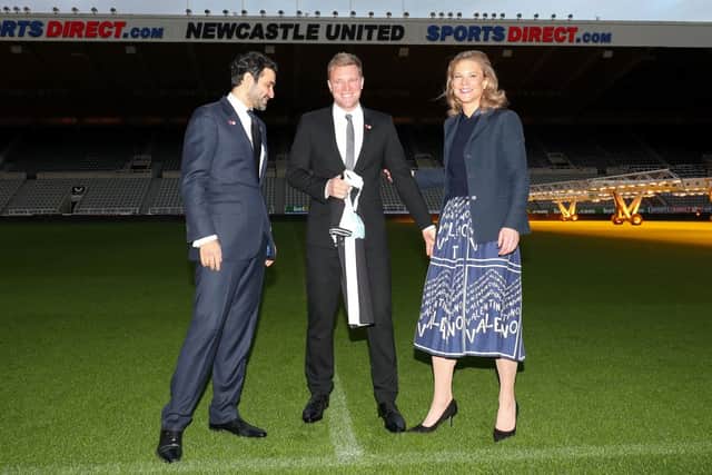 Newcastle United director Amanda Staveley (R), her husband Mehrdad Ghodoussi (L) pose with Newcastle United’s newly appointed manager Eddie Howe as he holds a team shirt during a press conference to announce Howe as the club’s manager, at their St James’ Park football ground in Newcastle-upon-Tyne, north east England on November 10, 2021.