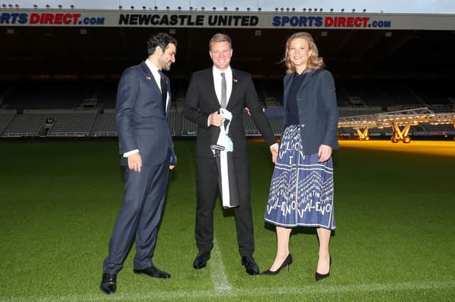 Newcastle United director Amanda Staveley (R), her husband Mehrdad Ghodoussi (L) pose with Newcastle United’s newly appointed manager Eddie Howe as he holds a team shirt during a press conference to announce Howe as the club’s manager, at their St James’ Park football ground in Newcastle-upon-Tyne, north east England on November 10, 2021. 