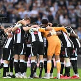 Newcastle United’s players form a group huddle ahead of the Premier League match with Tottenham Hotspur. 