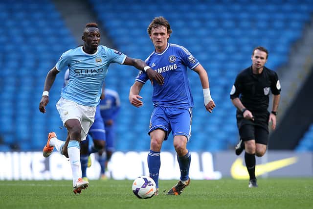 John Swift of Chelsea battles with Seko Fofana of Manchester City during the Barclays U21 Premier League match between Manchester City U21 and Chelsea U21 at Etihad Stadium on May 1, 2014 in Manchester, England.