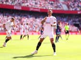 Diego Carlos of Sevilla FC celebrates after scoring their sides third goal during the LaLiga Santander match between Sevilla FC and Levante UD at Estadio Ramon Sanchez Pizjuan on October 24, 2021 in Seville, Spain. 