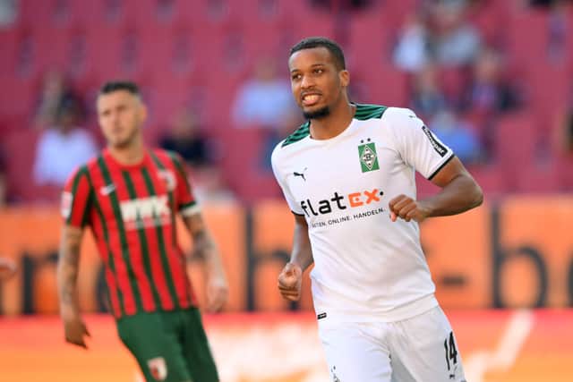 Alassane Plea of Borussia Moenchengladbach looks on during the Bundesliga match between FC Augsburg and Borussia Moenchengladbach at WWK-Arena on September 18, 2021 in Augsburg, Germany.