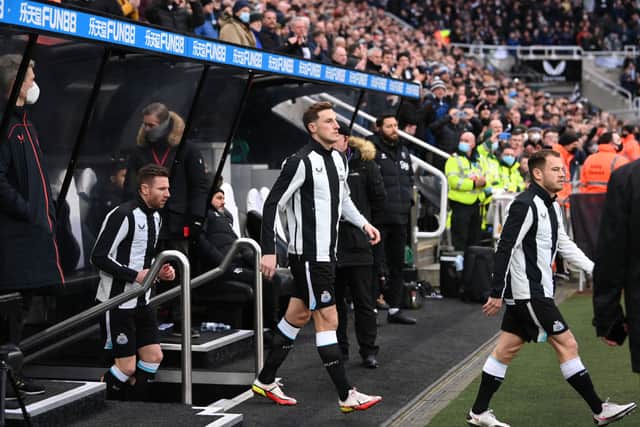 Newcastle striker Chris Wood enters the field from the tunnel for his debut before the Premier League match between Newcastle United and Watford at St. James Park on January 15, 2022 in Newcastle upon Tyne, England. 