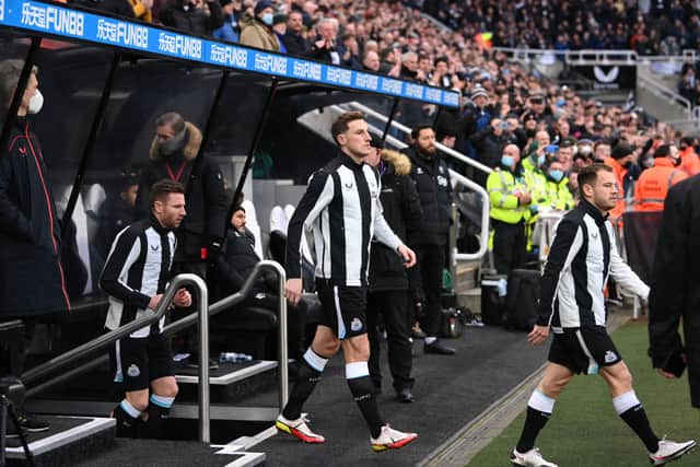 Newcastle striker Chris Wood enters the field from the tunnel for his debut before the Premier League match between Newcastle United and Watford at St. James Park on January 15, 2022 in Newcastle upon Tyne, England.