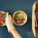 Picture of someone packing vegan food