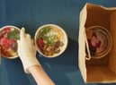 Picture of someone packing vegan food