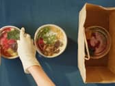Picture of someone packing vegan food