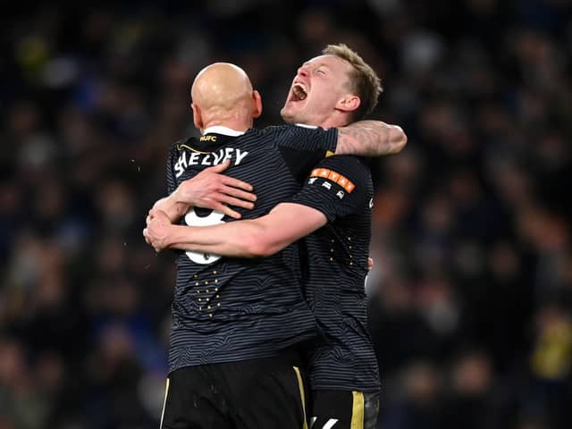 Jonjo Shelvey embraces Sean Longstaff of Newcastle United after their sides victory during the Premier League match between Leeds United and Newcastle United at Elland Road on January 22, 2022 in Leeds, England.