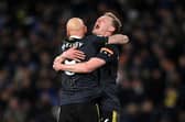 Jonjo Shelvey embraces Sean Longstaff of Newcastle United after their sides victory during the Premier League match between Leeds United and Newcastle United at Elland Road on January 22, 2022 in Leeds, England.