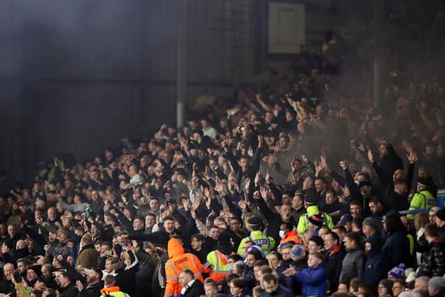Newcastle United fans celebrate their sides first goal during the Premier League match between Leeds United and Newcastle United at Elland Road on January 22, 2022 in Leeds, England. (Photo by George Wood/Getty Images)