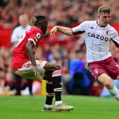 Manchester United's French defender Raphael Varane (L) vies with Aston Villa's English defender Matt Targett during the English Premier League football match between Manchester United and Aston Villa at Old Trafford