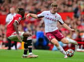 Manchester United's French defender Raphael Varane (L) vies with Aston Villa's English defender Matt Targett during the English Premier League football match between Manchester United and Aston Villa at Old Trafford