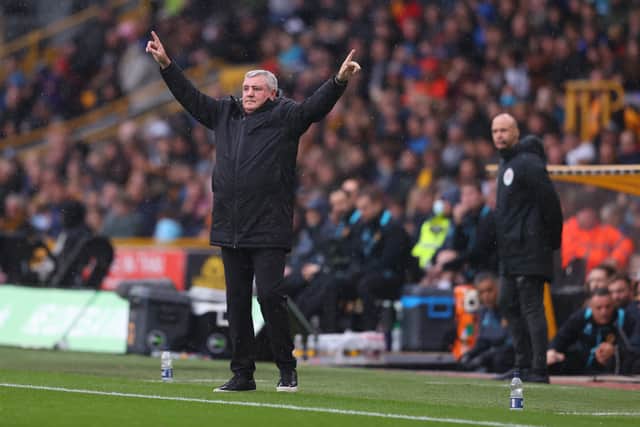 Steve Bruce, Manager of Newcastle United gives their team instructions during the Premier League match between Wolverhampton Wanderers and Newcastle United at Molineux on October 02, 2021 in Wolverhampton, England