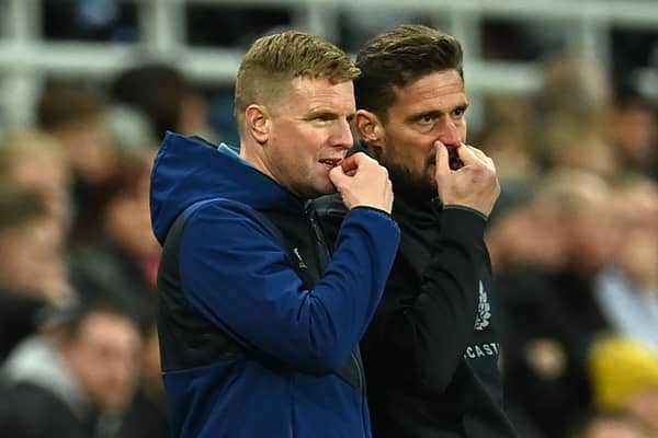 Newcastle United’s head coach Eddie Howe (L) and his assistant Jason Tindall gesture on the touchline.