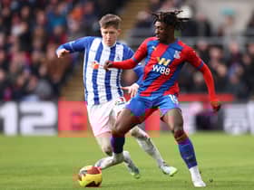Eberechi Eze of Crystal Palace is challenged by Tom Crawford of Hartlepool United during the Emirates FA Cup Fourth Round match between Crystal Palace and Hartlepool United at Selhurst Park on February 05, 2022 in London, England