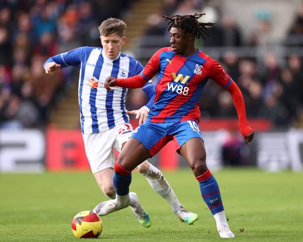 Eberechi Eze of Crystal Palace is challenged by Tom Crawford of Hartlepool United during the Emirates FA Cup Fourth Round match between Crystal Palace and Hartlepool United at Selhurst Park on February 05, 2022 in London, England